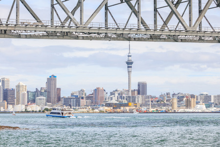 Auckland, New Zealand- December 10, 2013. Auckland city and sky tower view from the Auckland harbor bridge.のeditorial素材