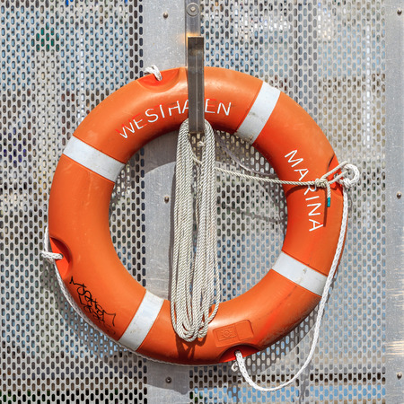 Auckland, New Zealand- December 10, 2013. The life buoy is hanged around Westhaven marina for safety and rescue.のeditorial素材