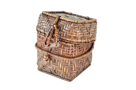 A small handmade wicker box is unlocked on white background.の写真素材