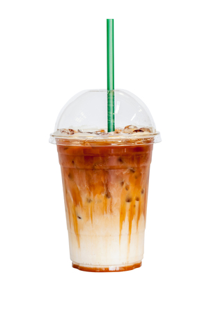 Iced latte coffee topped with fresh milk layer isolated on white background.の写真素材
