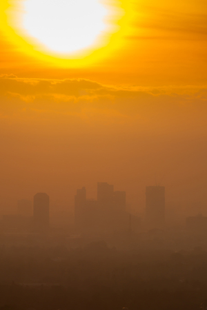 Sunrise over downtown Bangkok in cloudy day.  Silhouette cityscape. の写真素材