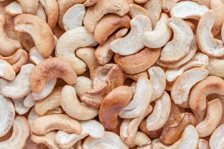 Close up pile of cashew nuts, the different texture of inside and outside nuts.の写真素材