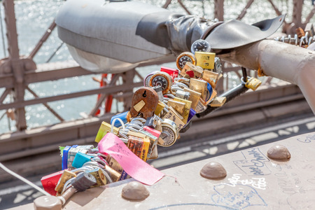 New York, USA- May 21, 2014. Love locks on Brooklyn bridge in New York City, USA.のeditorial素材