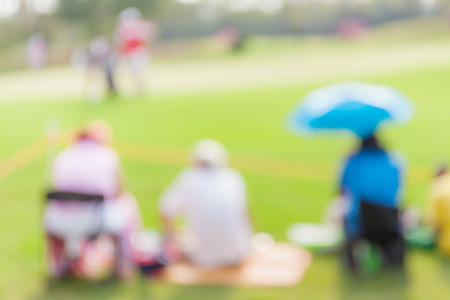 Blurred photo of spectators are looking the match in golf tournament.の写真素材