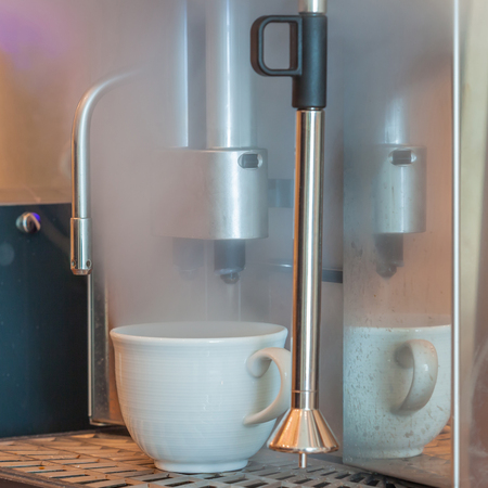 Boiling water and steaming process of coffee machines in coffee shop.の写真素材