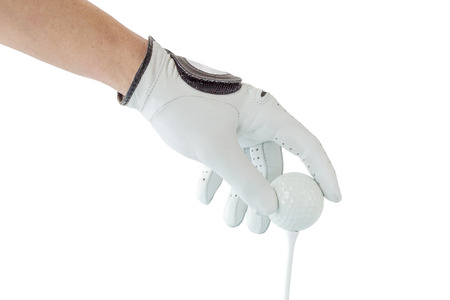 Close up the golfer hand in glove holding the golf ball with tee ready to start the golf game.の写真素材