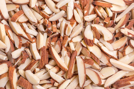 Detail of roasted almond sticks pile, natural source of good fat and protein.の写真素材