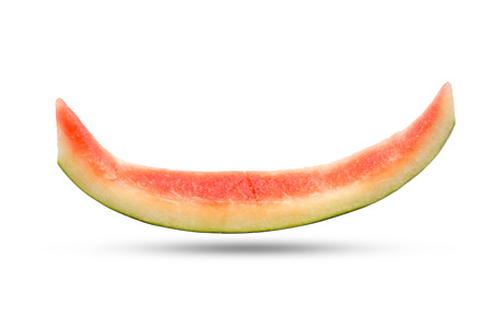 Slice of watermelon rind after eaten up on the white background and the shadow below.の写真素材