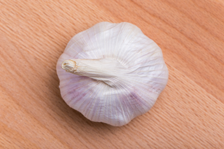 Top view of white and fresh raw garlic bulbs place on wooden table, valuable herbal for healthiness.の写真素材