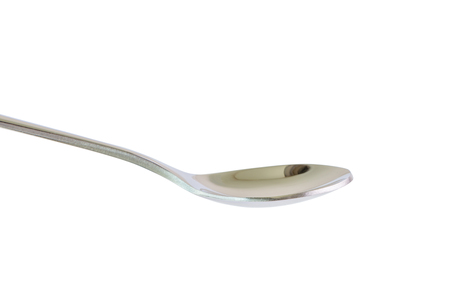 Shiny silver spoon isolated on white background, luxury utensil in kitchen.の写真素材