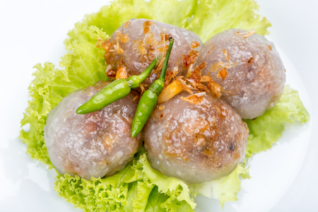Tapioca sago balls with pork filling served with vegetable and chili, traditional Thai appetizer dish.の写真素材