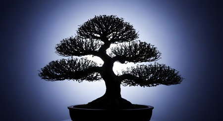 The perfect, intricate silhouette of a classic bonsai tree is starkly backlit by a cool blue spotlight. The image captures the artful and serene nature of this traditional Japanese practice, symbolizing patience, harmony, and zen balance.の素材