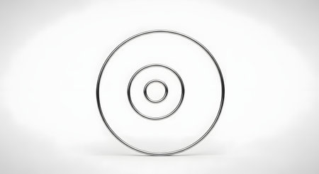 A minimalist 3D rendering of two concentric chrome rings standing upright against a clean white background. The polished metallic surface reflects light, creating a sleek and modern aesthetic. The image represents concepts like focus, infinity, targets, portals, and simplicity.の素材