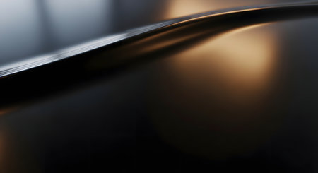 A sensual, abstract macro photograph of a smooth, dark metallic surface with a graceful curve. Warm, golden light reflects off the sleek material, creating an elegant and luxurious background with a minimalist feel.の素材
