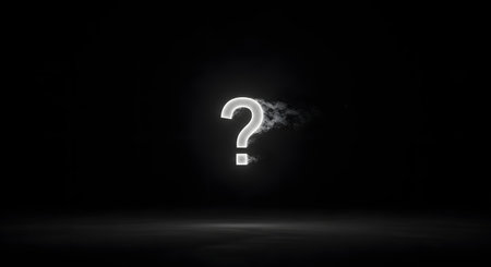 A single, brightly glowing white question mark hovers in the center of a dark, empty space, with wisps of smoke or fog. The minimalist and dramatic image represents mystery, questions, the unknown, problems, and the search for answers.の素材