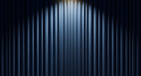 A closed, dark blue corrugated metal wall or theater curtain illuminated by a single bright spotlight from the top center. The light creates a gradient, highlighting the vertical lines and texture of the surface.の素材