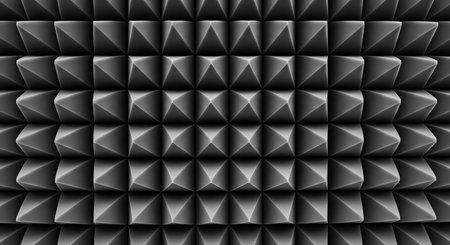 A close-up, head-on shot of a grey acoustic foam panel, revealing its geometric pattern of pyramid shapes. This material is used for soundproofing and sound absorption in recording studios, creating a textured, abstract background.の素材