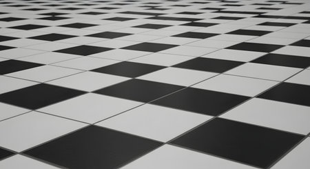 A classic black and white checkered floor is shown from a low angle, creating a strong sense of perspective as the pattern recedes into the distance. This geometric and timeless design can be used as an abstract background, representing concepts like strategy, duality, or retro style.の素材