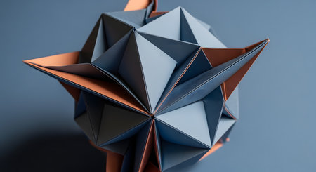A complex geometric modular origami sculpture, possibly a kusudama star, is meticulously crafted from blue-gray and orange paper. The intricate folds and sharp points of the papercraft art are displayed against a solid, complementary blue background.の素材