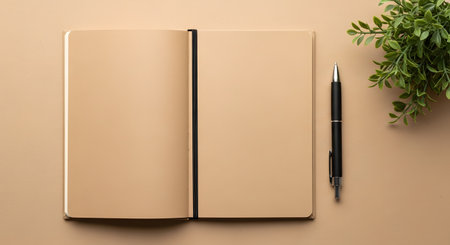 A flat lay or top-down view of an open notebook with blank brown craft paper pages, a black pen, and a small potted plant on a matching brown background. This is a perfect mockup for journaling, writing, sketching, or planning concepts.の素材