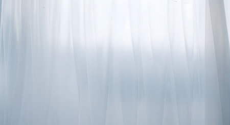 A minimalist abstract background featuring a soft, bright white and light blue gradient with subtle vertical streaks. The translucent, ethereal quality of the texture makes it suitable for clean, modern designs, backdrops, or wellness themes.の素材