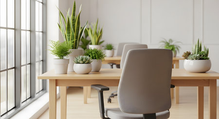 A bright and modern office interior featuring wooden desks and ergonomic chairs. Numerous potted plants, including snake plants and succulents, are placed on the desks, creating a biophilic and healthy work environment.の素材
