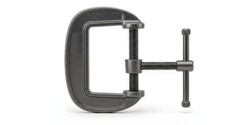 A heavy-duty, dark metal C-clamp, also known as a G-clamp, is isolated on a clean white background. This industrial woodworking or metalworking tool is shown clearly, highlighting its screw thread and T-bar handle.の素材