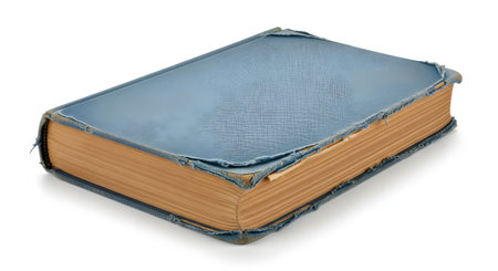 An old, closed book with a worn and frayed blue fabric cover, isolated on a white background. The yellowed pages and weathered binding suggest age, history, and knowledge.の素材