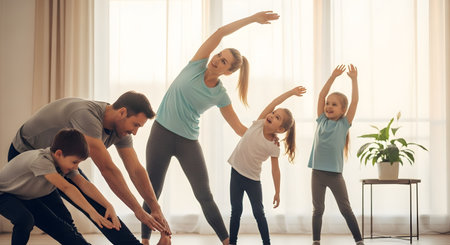 A cheerful family of four doing yoga stretching exercises together in their bright living room. Parents and children are smiling and staying active, promoting a healthy lifestyle at home.の素材