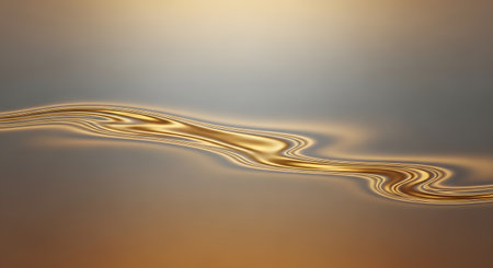 Smooth, golden liquid forms a gentle, flowing wave across a blurred background. The abstract image conveys a sense of luxury, elegance, and fluid motion, resembling molten gold or silk.の素材