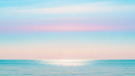A serene seascape featuring a calm ocean under a pastel-colored sky with shades of pink, purple, and blue. The sunlight glitters gently on the water surface, creating a peaceful minimalist horizon.の素材