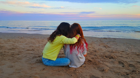 Two girlfriends telling secretsの写真素材