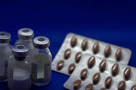Vaccine bottles with pills with labels