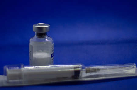 single Vaccine bottle with syringe