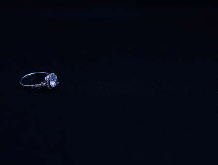 diamond ring jewelry on black background - copy space area
