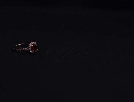 ruby ring jewelry on black background copy space area