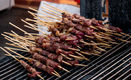 typical Italian arrosticini of lamb Arrosticini on wooden skewerの写真素材