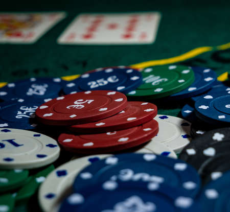 poker card game chips on a green tableの写真素材