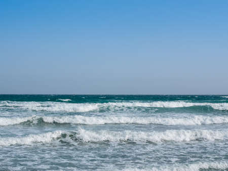 rough blue sea with waves with foamの写真素材