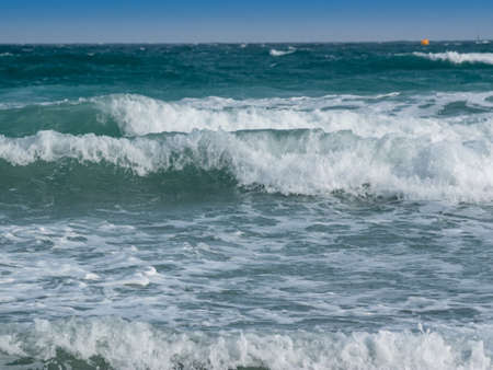 rough blue sea with waves with foamの写真素材