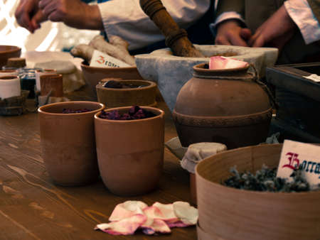 medieval reenactment - artist painter's table, tools to create colors, reduce minerals to dust and...