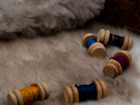 medieval reenactment objects, sewing set with wool coils on a fur coat, blank copy space areaの写真素材