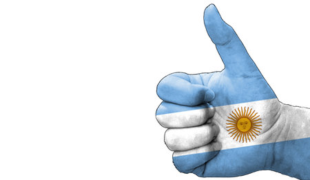 thumbs up in approval with the Argentinian flag paintedの写真素材
