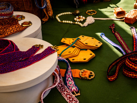 close-up shot of medieval products such as cloth straps and jewelry. Art and manufacturing historical reenactmentの写真素材