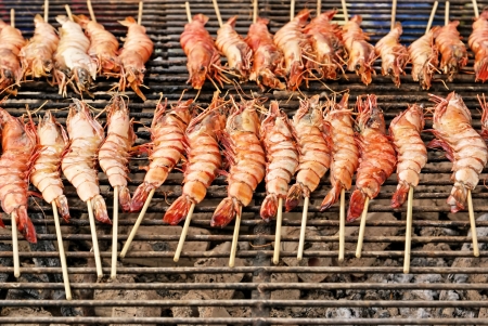 Grilled shrimps on grill and stoveの写真素材