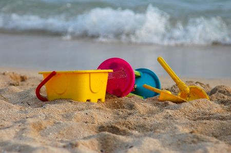 Vacation image of children's beach toys on the sandの写真素材