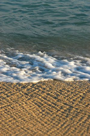 Vacation image of waves on a tropical beachの写真素材