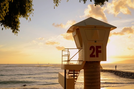 A Lifeguard Station On Waikiki Beach In Hawaii At Sunsetの写真素材