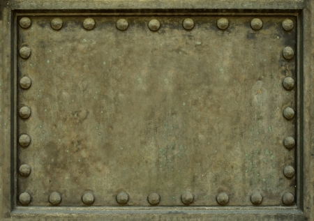 Background Texture Of Heavy Protective Metal Plate With Rivetsの写真素材