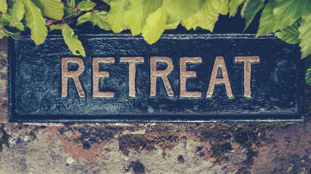 Retro Styled Image Of A Hidden Sign For A Spiritual Retreatの写真素材